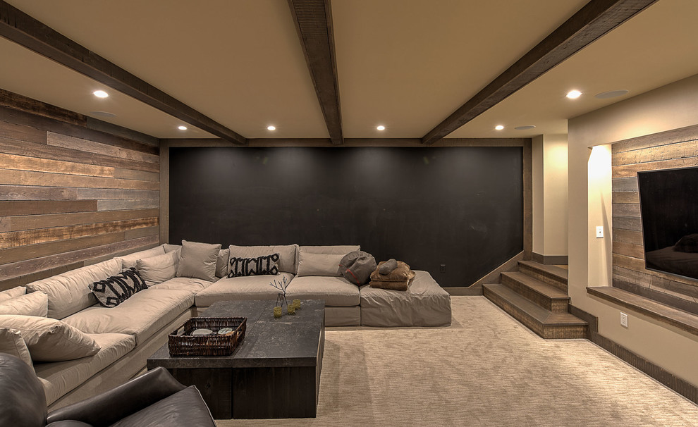 Photo of a large rustic fully buried basement in Other with brown walls, porcelain flooring, a hanging fireplace, a tiled fireplace surround and grey floors.