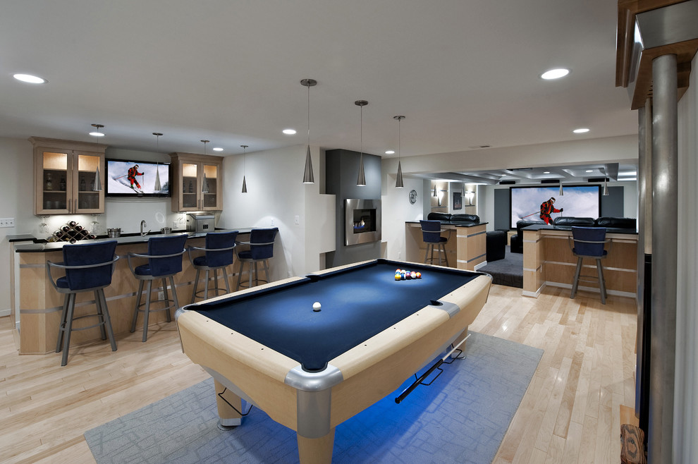 Contemporary basement in DC Metro with a home bar.