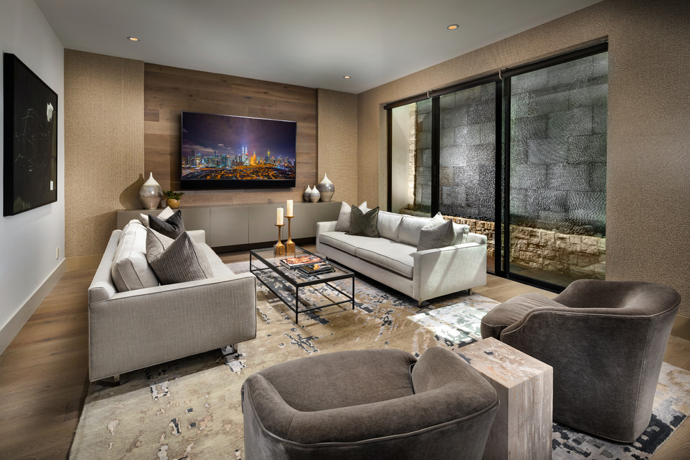 Medium sized contemporary living room in Phoenix with medium hardwood flooring, brown walls and no fireplace.