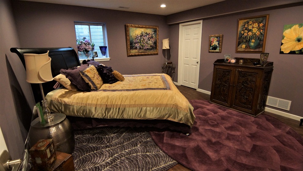 Photo of a medium sized bohemian look-out basement in Other with purple walls, vinyl flooring and brown floors.