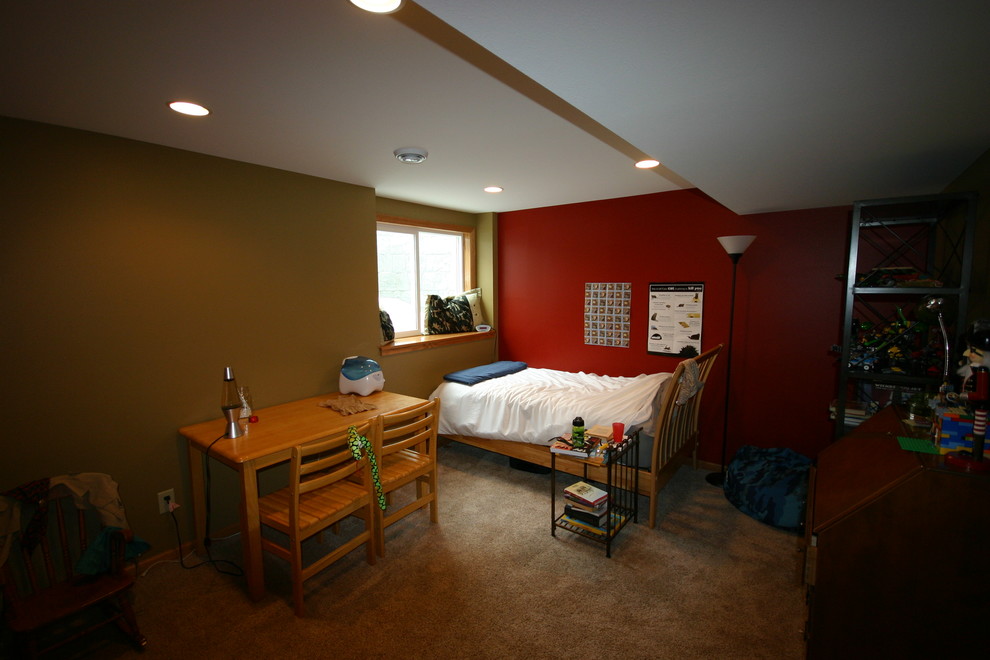 Medium sized modern fully buried basement in Milwaukee with brown walls and carpet.