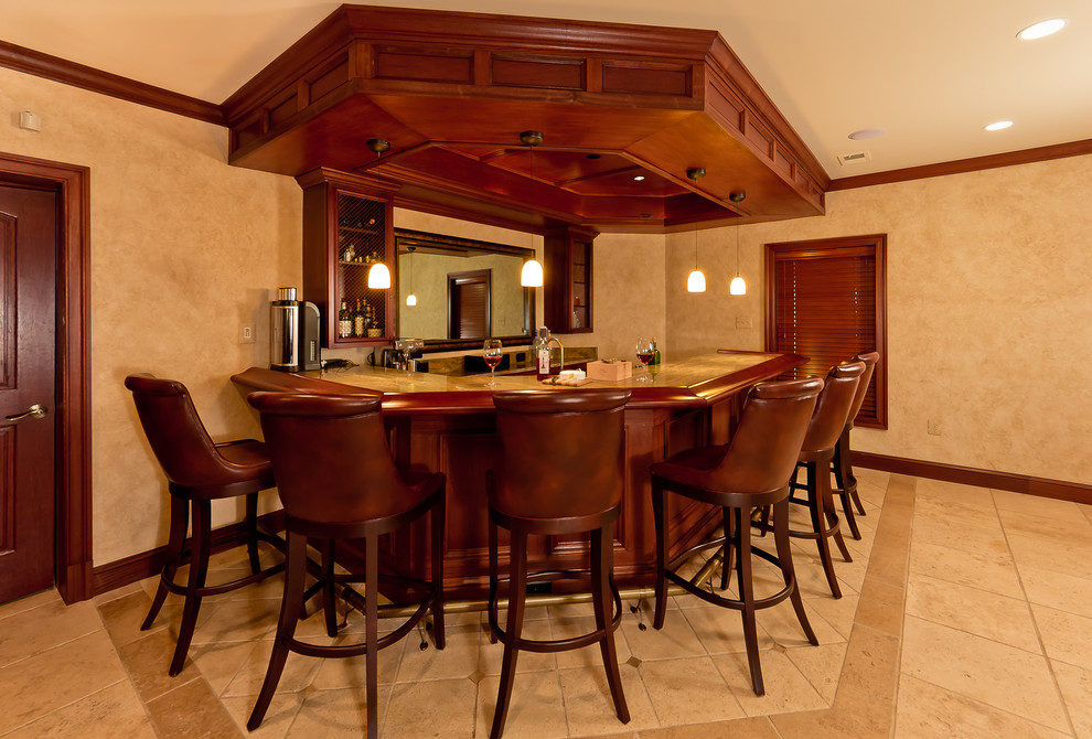 Expansive traditional home bar in DC Metro with porcelain flooring.