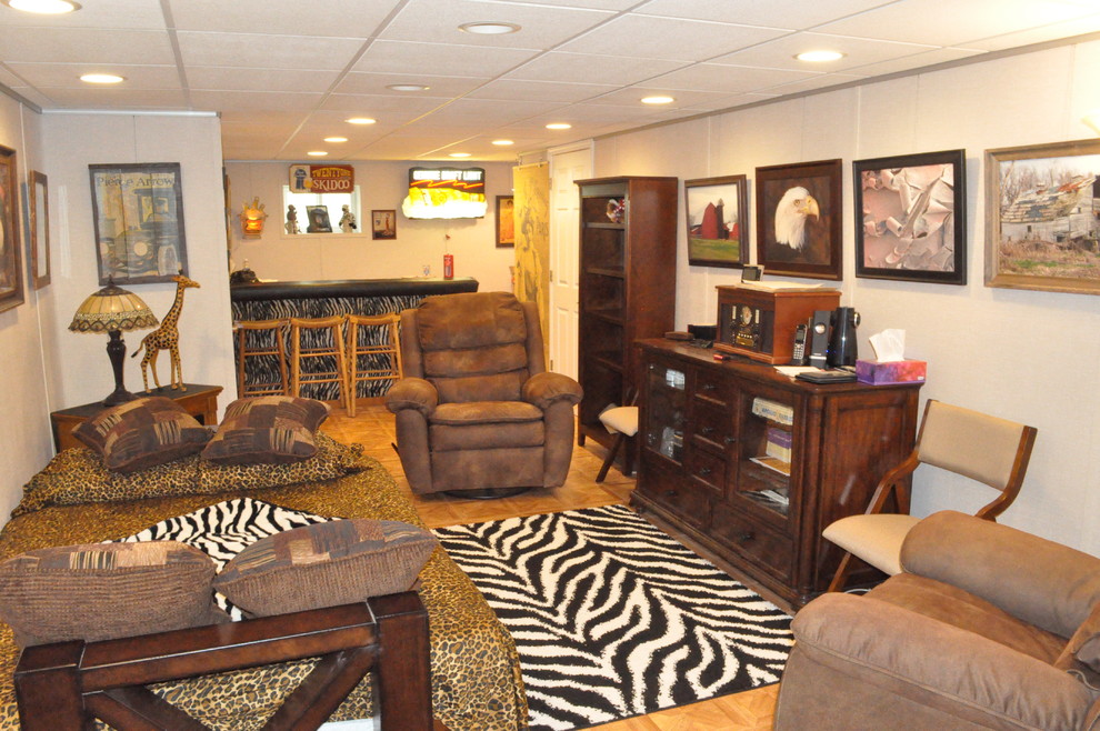 Large traditional basement in St Louis with white walls, light hardwood flooring, no fireplace and orange floors.