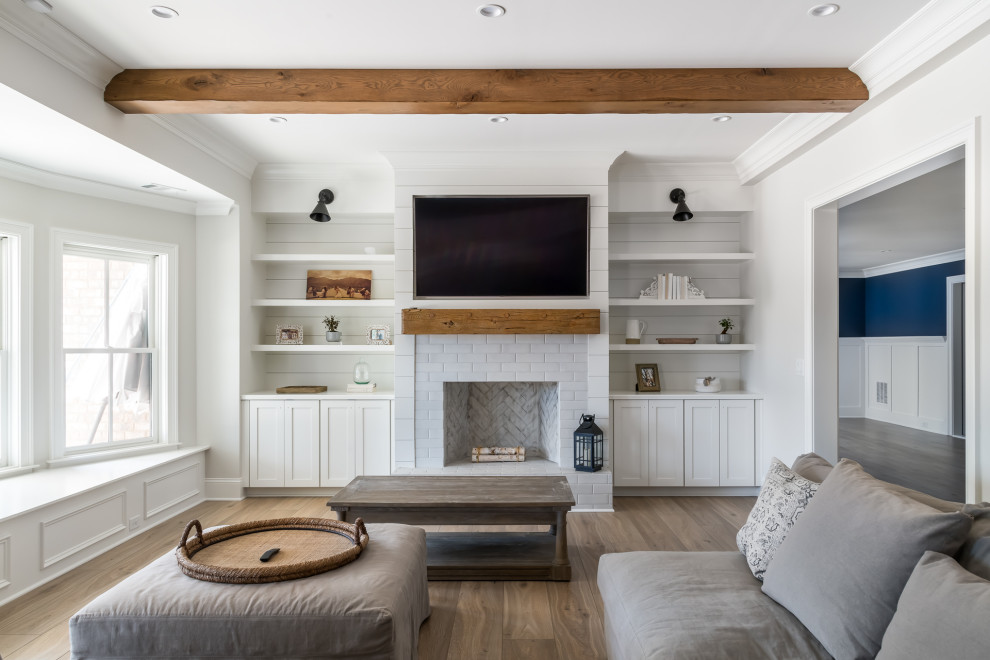 Large beach style walk-out vinyl floor, beige floor, exposed beam and shiplap wall basement photo in Atlanta with a bar, gray walls, a standard fireplace and a tile fireplace
