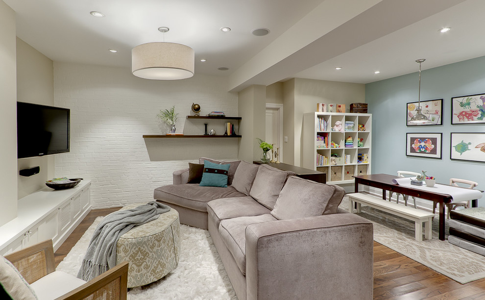Example of a classic underground medium tone wood floor basement design in Toronto with blue walls and no fireplace