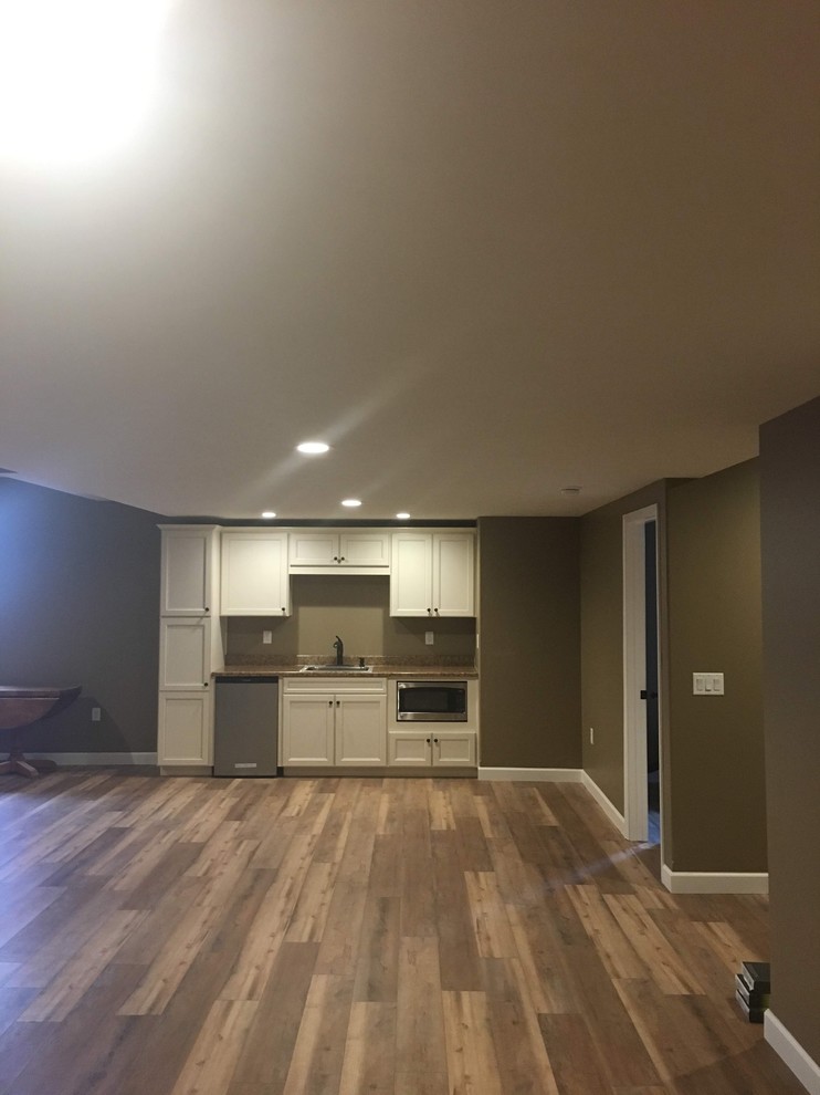 Basement finishes with luxury vinyl plank flooring Modern Basement