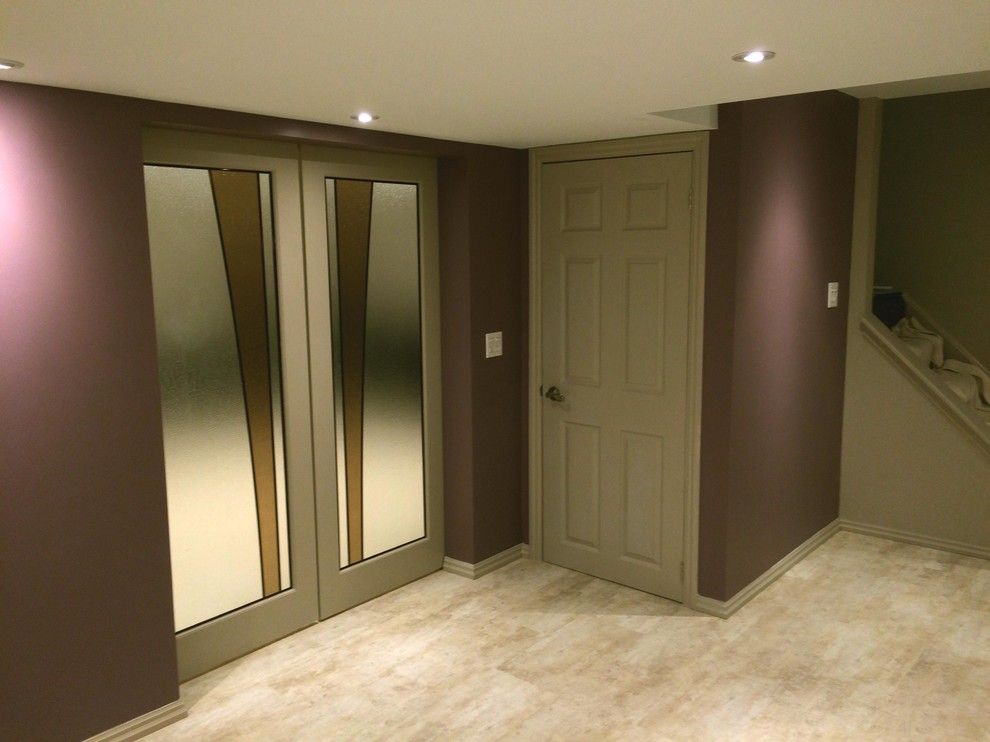 Inspiration for a large modern underground vinyl floor basement remodel in Toronto with purple walls