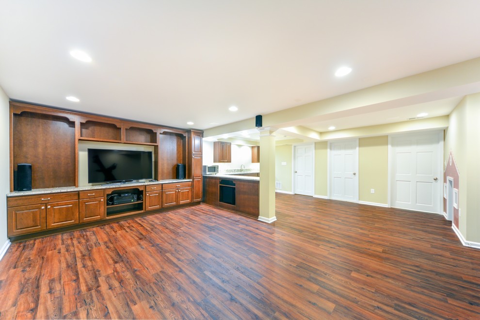 Inspiration for a medium sized classic walk-out basement in DC Metro with beige walls, a home bar, vinyl flooring, no fireplace, brown floors and feature lighting.