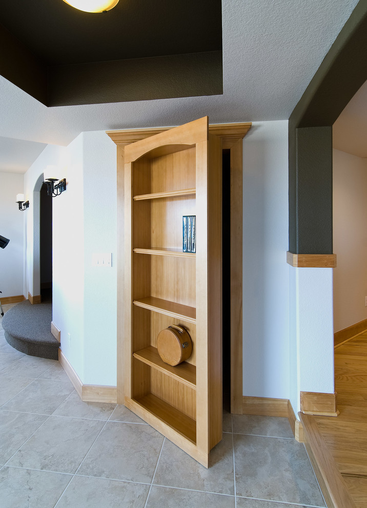 Inspiration for a large transitional look-out porcelain tile and beige floor basement remodel in Denver with white walls and no fireplace