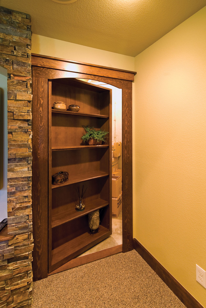 Inspiration for a large timeless walk-out carpeted and brown floor basement remodel in Denver with white walls and no fireplace