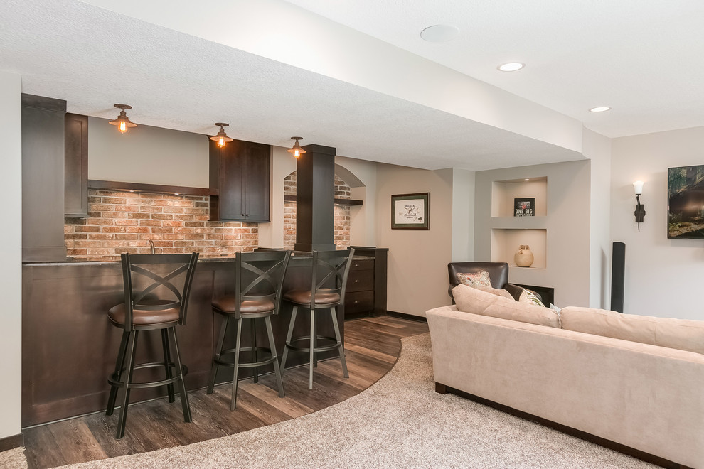 Inspiration for a large classic walk-out basement in Minneapolis with carpet, grey walls, a ribbon fireplace, a metal fireplace surround and beige floors.