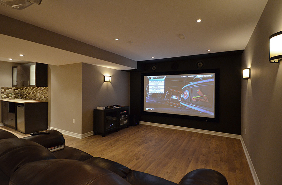 Inspiration for a classic home cinema in Toronto with brown floors.