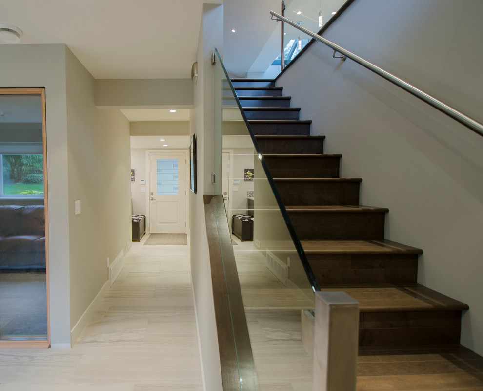 Large classic walk-out basement in Vancouver with beige walls.