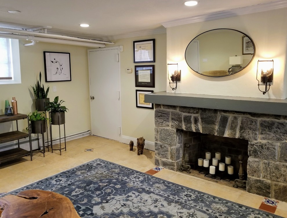Medium sized bohemian look-out basement in New York with yellow walls, ceramic flooring, a standard fireplace, a stone fireplace surround and yellow floors.