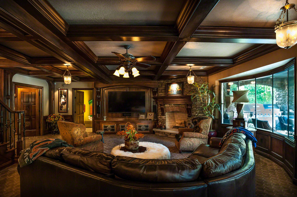 Example of a large eclectic walk-out basement design in Cleveland with brown walls, a standard fireplace and a stone fireplace