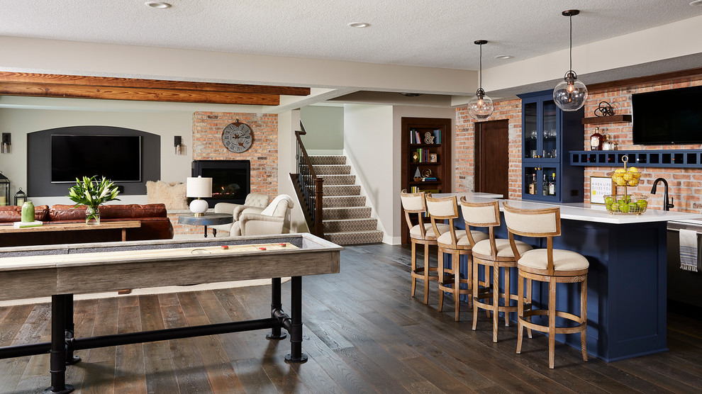 Example of a large urban walk-out vinyl floor and brown floor basement design in Minneapolis with gray walls, a corner fireplace and a brick fireplace