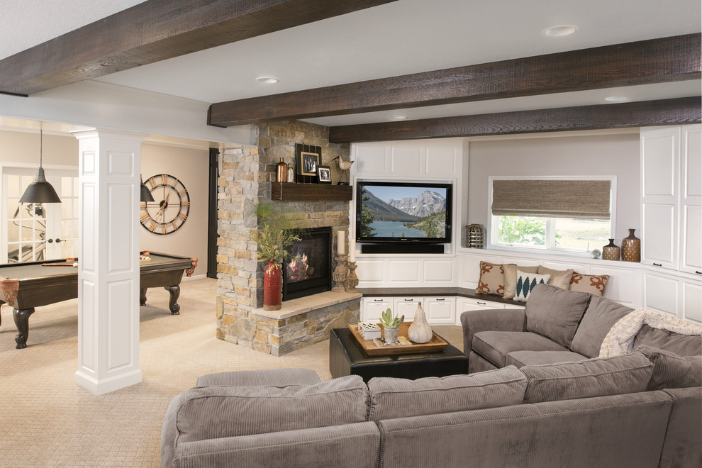 Inspiration for a large transitional look-out carpeted and gray floor basement remodel in Minneapolis with a standard fireplace, a stone fireplace and white walls
