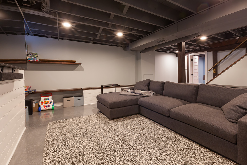 Photo of a medium sized modern look-out basement in Chicago with grey walls, concrete flooring, no fireplace and blue floors.