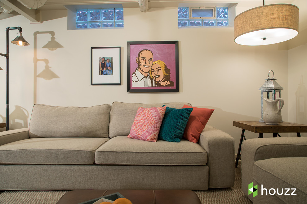 Example of a small transitional underground concrete floor and brown floor basement design in Detroit with no fireplace and beige walls