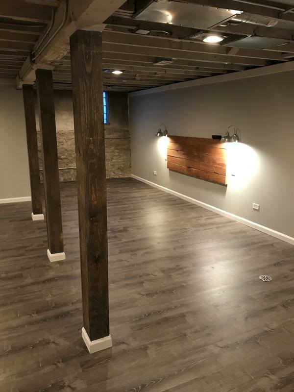 Design ideas for a medium sized contemporary basement in Chicago with porcelain flooring and beige floors.