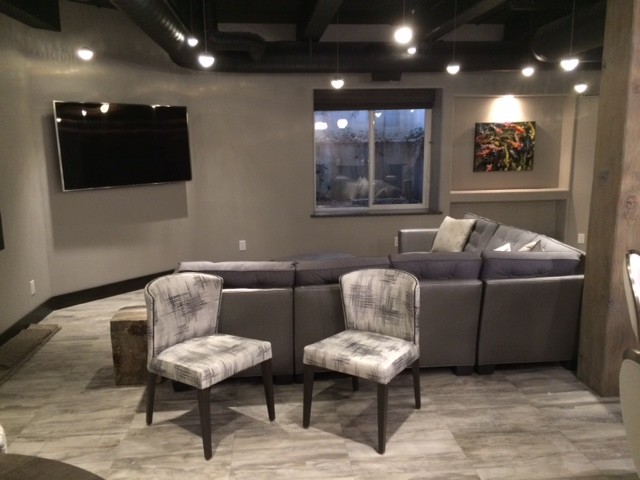 Example of a small trendy porcelain tile home theater design in Other with gray walls