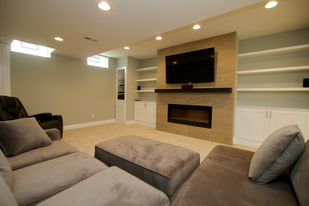 Basement - huge modern walk-out basement idea in Columbus with green walls and a ribbon fireplace