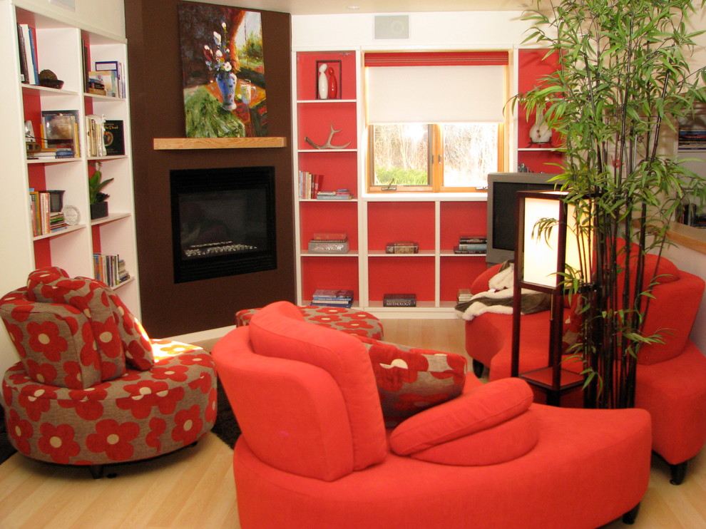 Photo of a contemporary basement in Calgary with red walls and a standard fireplace.