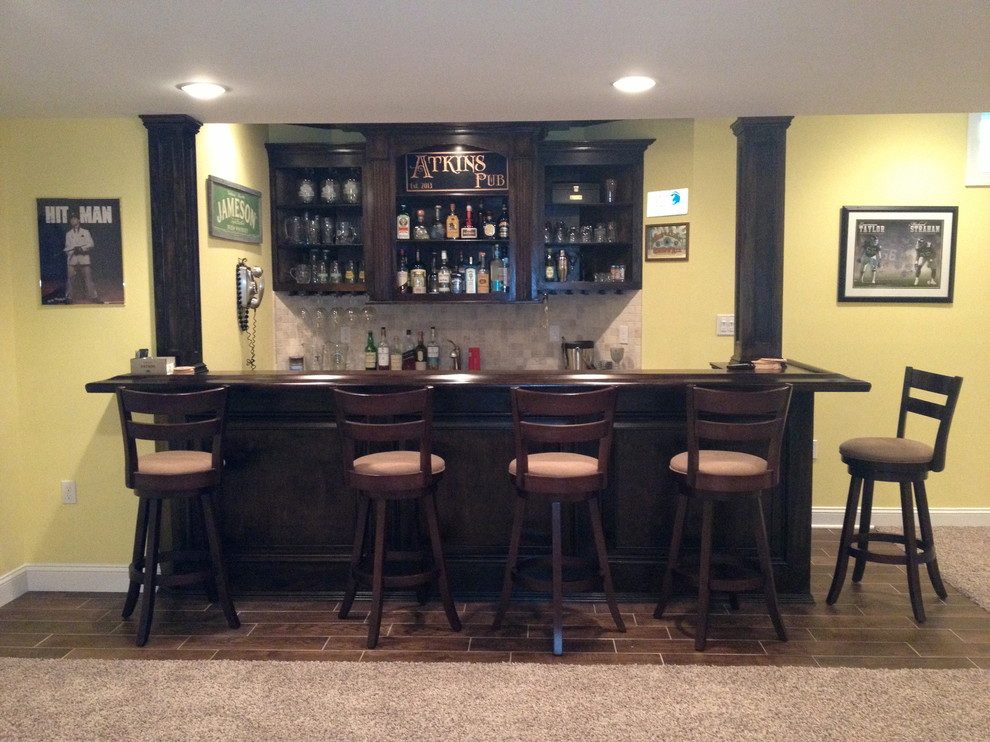 Photo of a traditional home bar in New York.