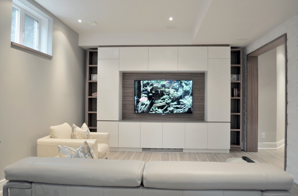 Example of a mid-sized trendy walk-out slate floor basement design in Toronto with gray walls