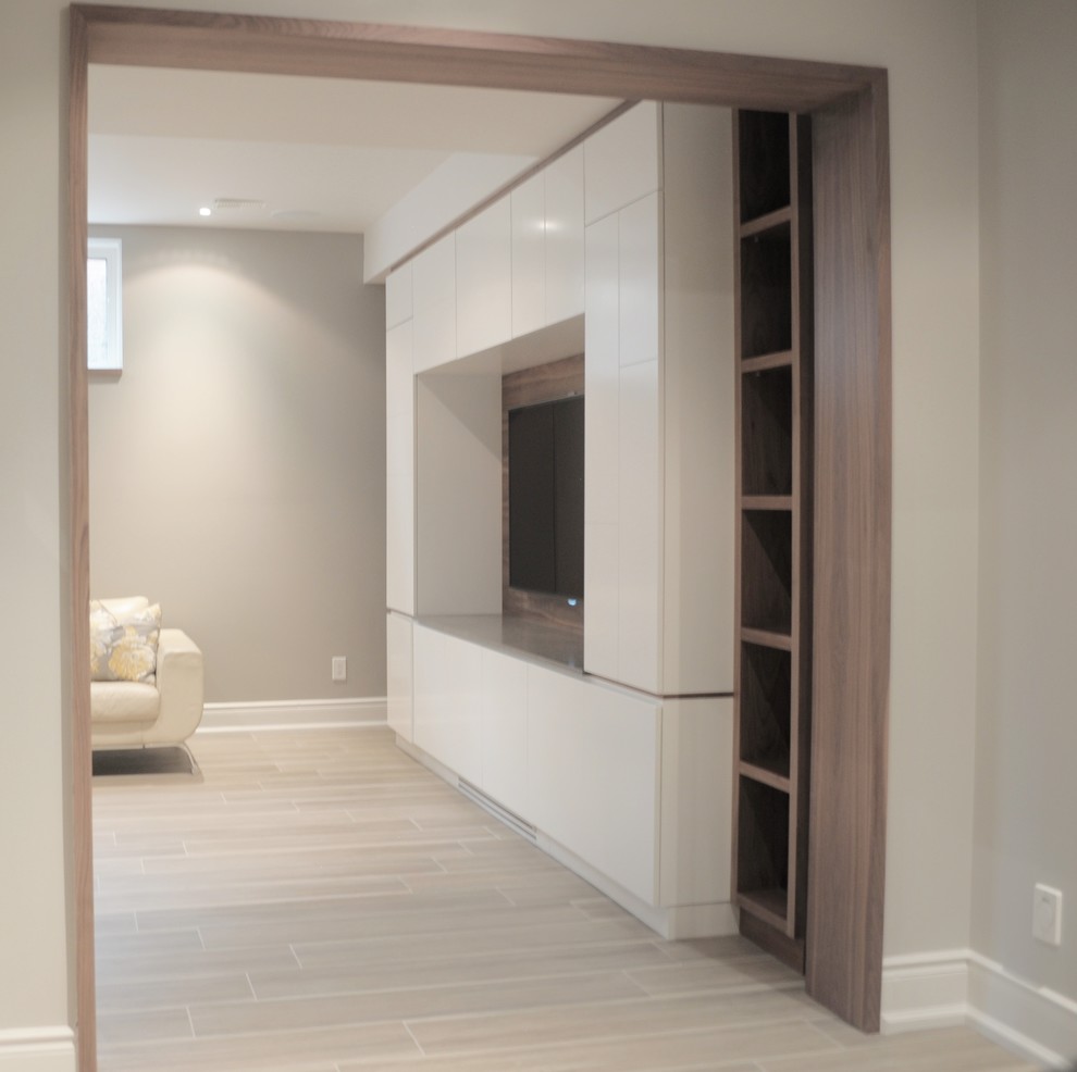 Large trendy walk-out porcelain tile basement photo in Toronto with gray walls