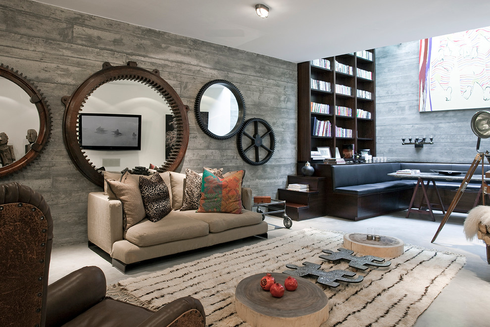 Diseño de sala de estar actual con paredes grises y suelo de cemento