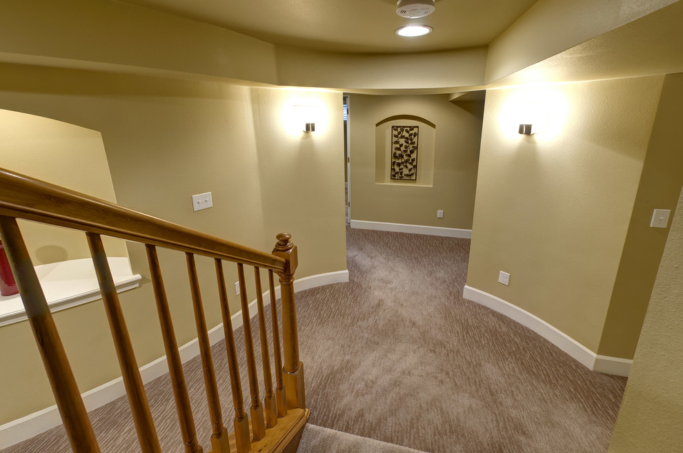 Mid-sized elegant look-out carpeted and brown floor basement photo in Denver with yellow walls and no fireplace