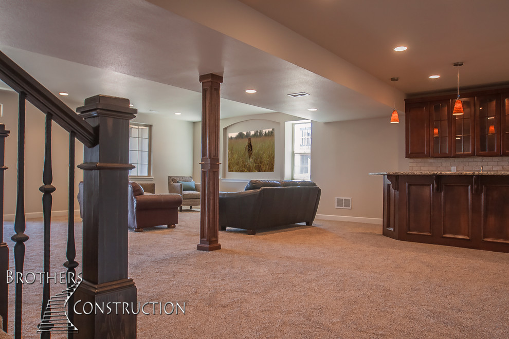 Basement - mid-sized traditional walk-out carpeted basement idea in Denver with beige walls and no fireplace