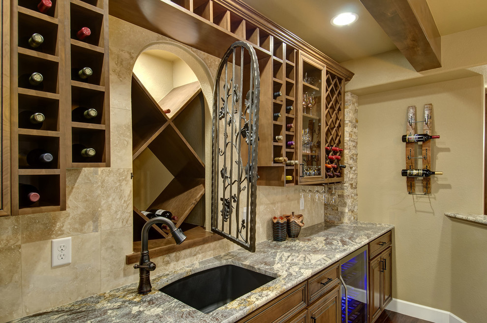 Example of a mid-sized transitional carpeted and brown floor wine cellar design in Denver