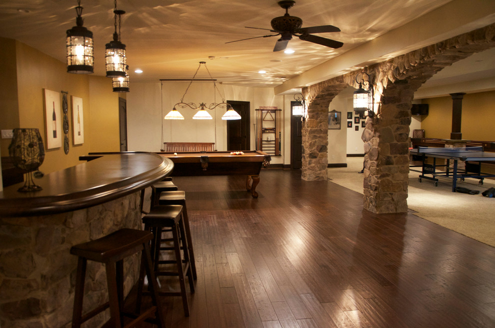 Basement with Curved Bar and Entertainment Areas Traditional