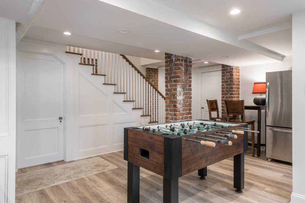 Large arts and crafts walk-out brown floor basement game room photo in Atlanta with white walls