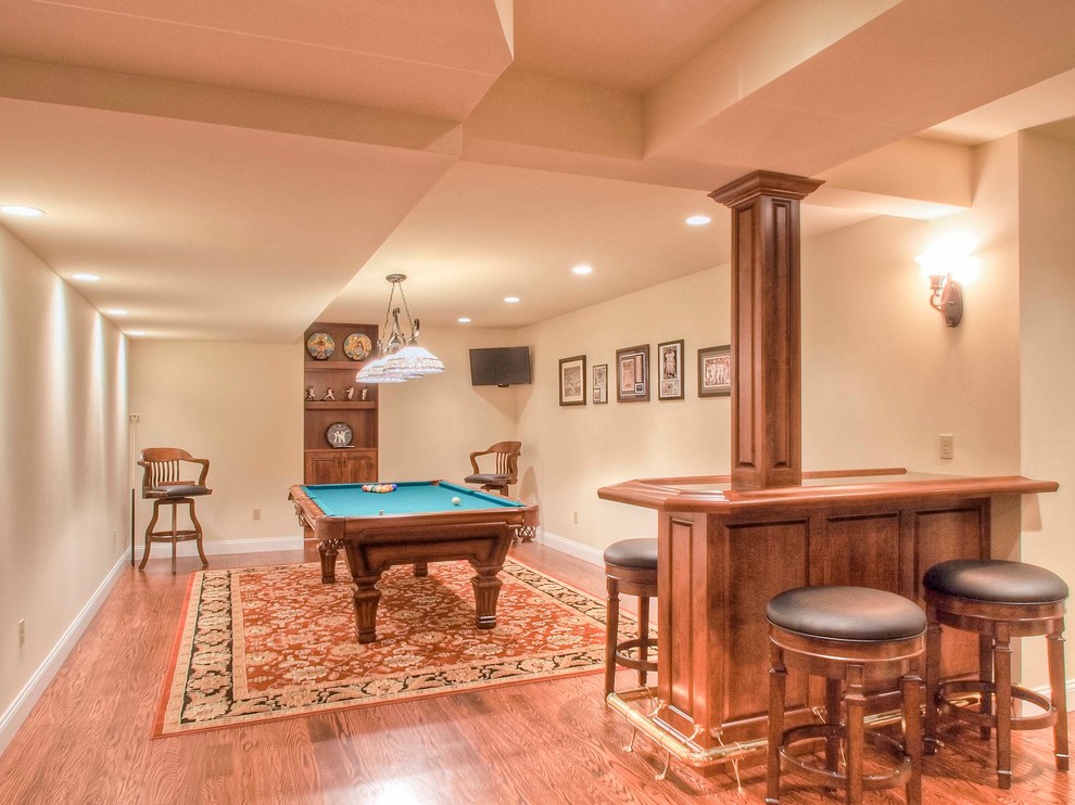 Inspiration for a large traditional basement in Philadelphia with white walls and medium hardwood flooring.