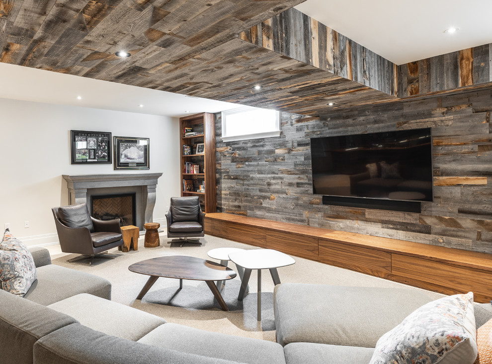 This is an example of a medium sized contemporary look-out basement in Toronto with carpet, a standard fireplace, white walls, white floors and a feature wall.