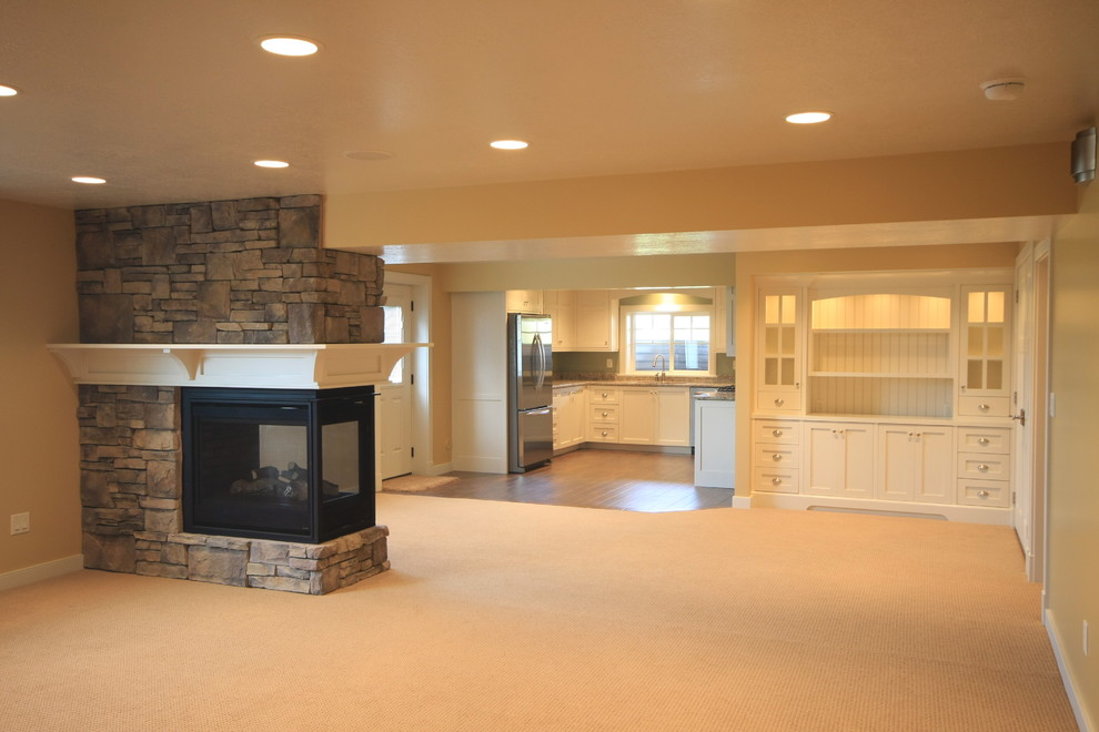 Basement - mid-sized transitional carpeted basement idea in Salt Lake City with yellow walls and a stone fireplace