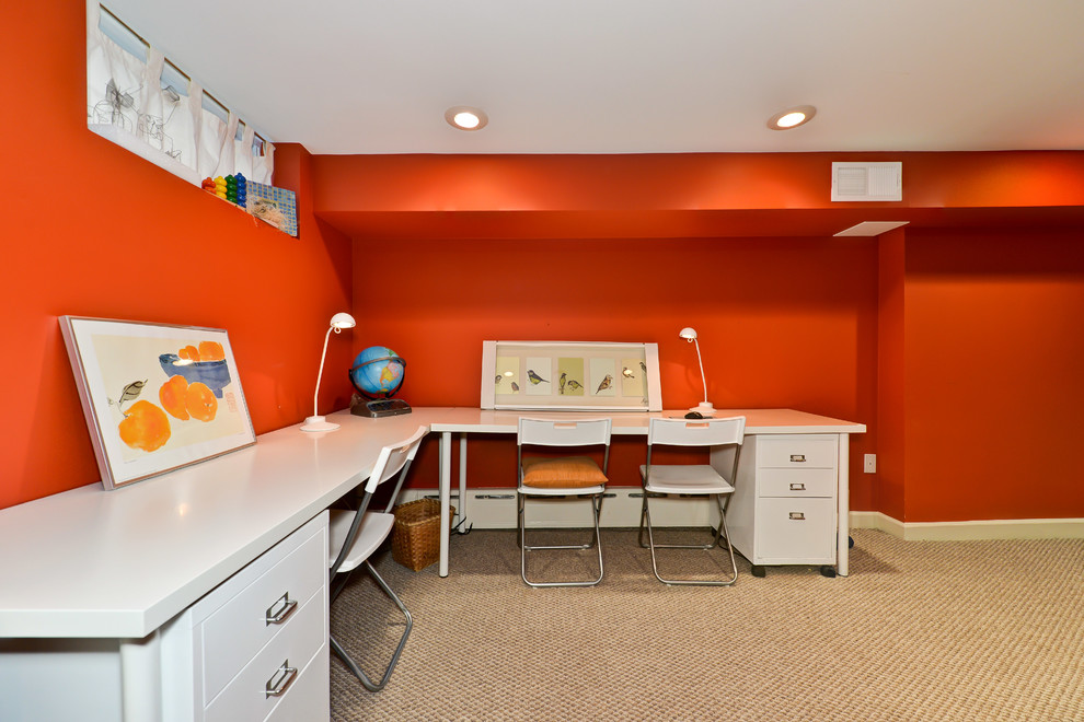 Photo of a traditional basement in DC Metro with orange walls.