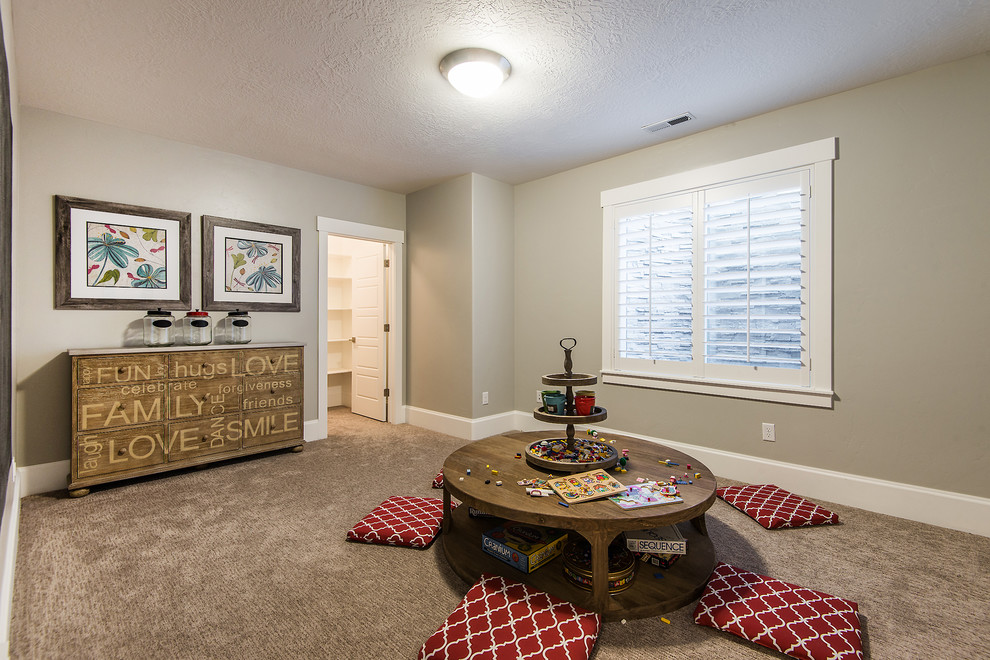 This is an example of a medium sized traditional fully buried basement in Salt Lake City with beige walls, carpet, no fireplace and beige floors.