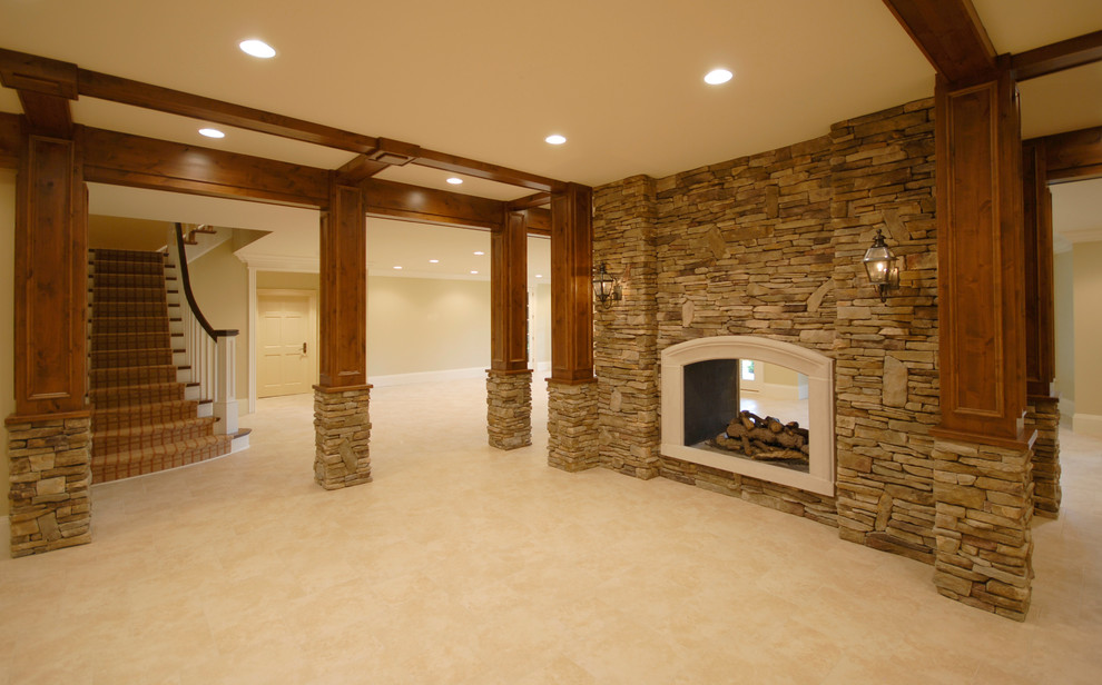 Basement - large rustic carpeted and beige floor basement idea in Birmingham with beige walls, a two-sided fireplace and a stone fireplace
