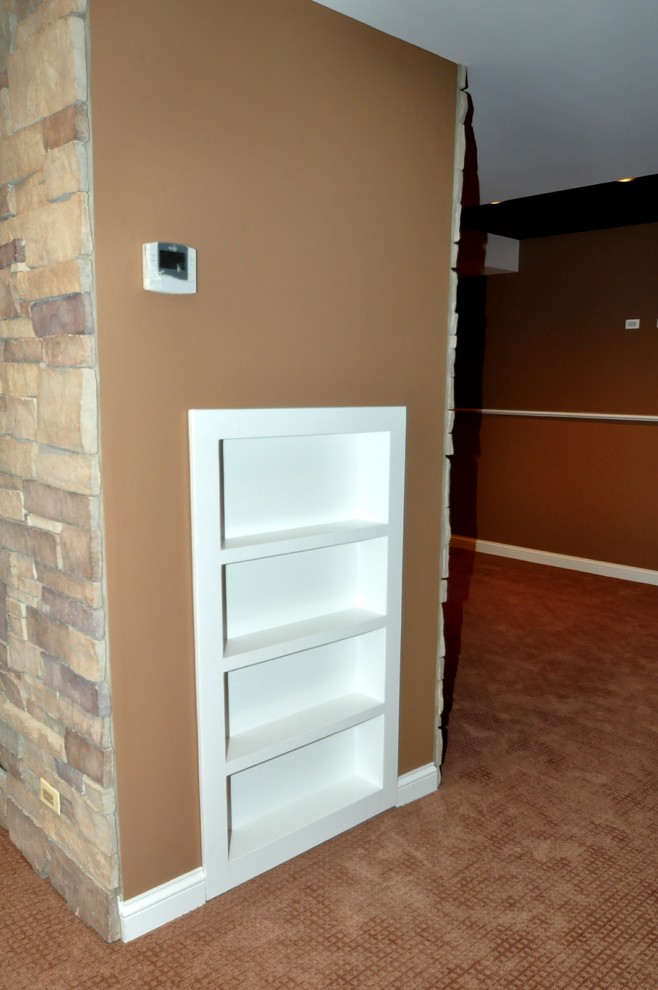 Inspiration for a large modern look-out carpeted basement remodel in Chicago with beige walls and no fireplace