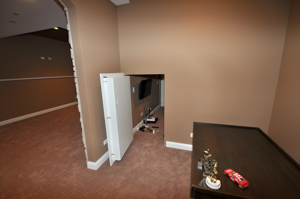 Example of a large minimalist look-out carpeted basement design in Chicago with beige walls and no fireplace
