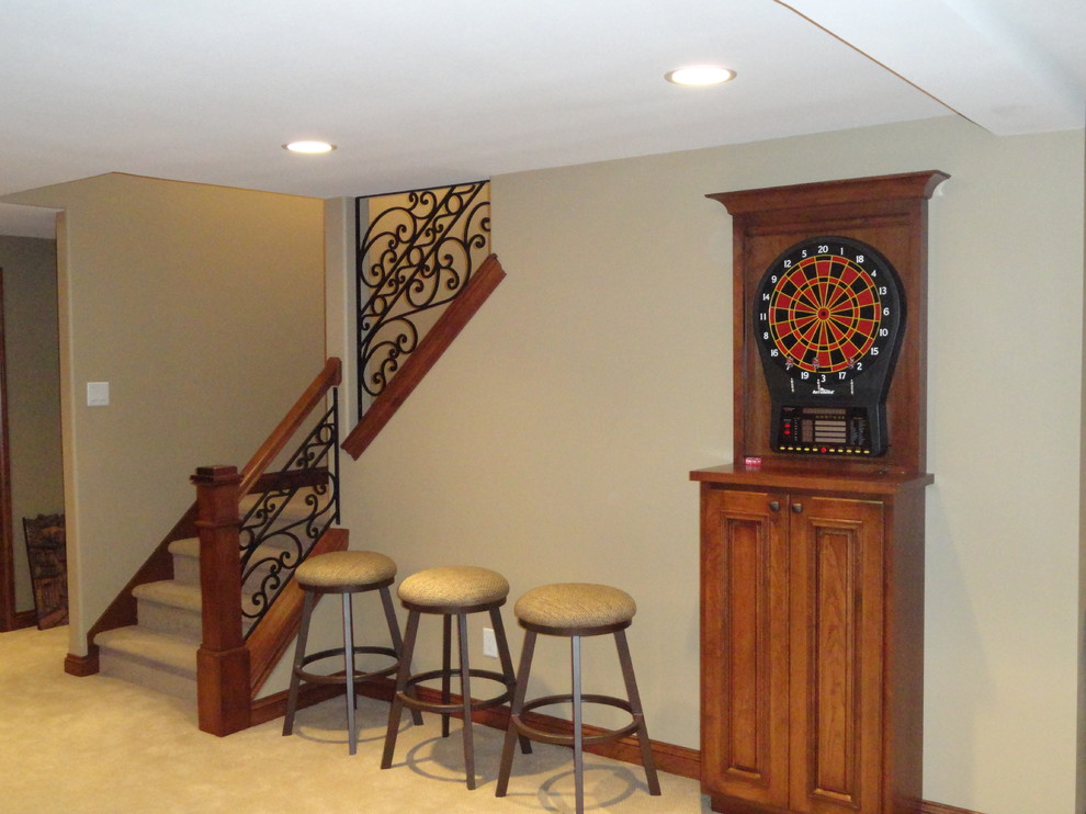 Basement - traditional carpeted basement idea in Milwaukee with beige walls and no fireplace