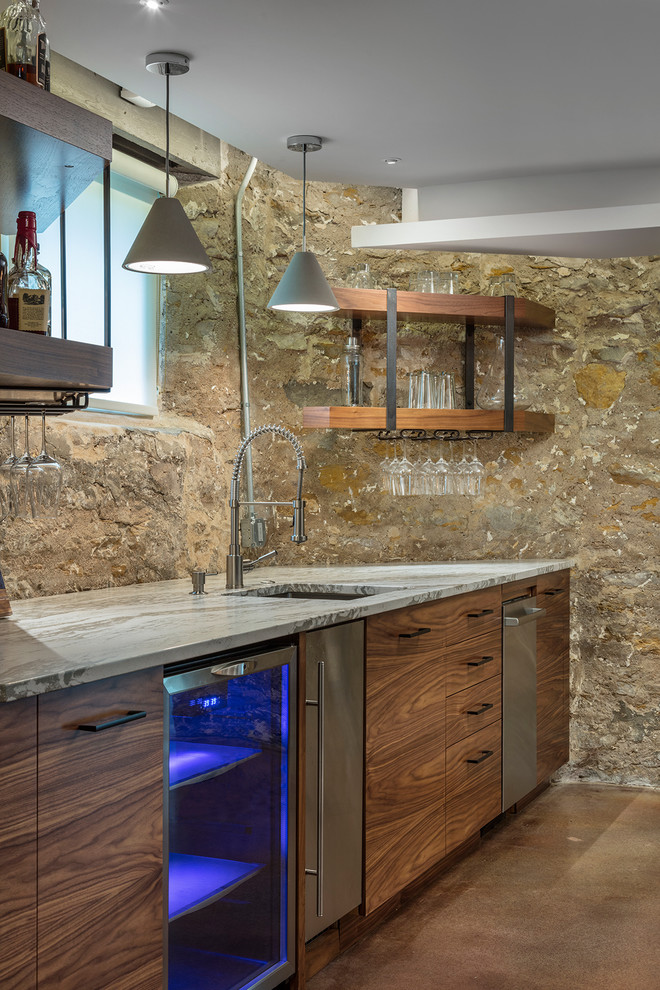 Home bar - mid-sized rustic concrete floor and brown floor home bar idea in Kansas City