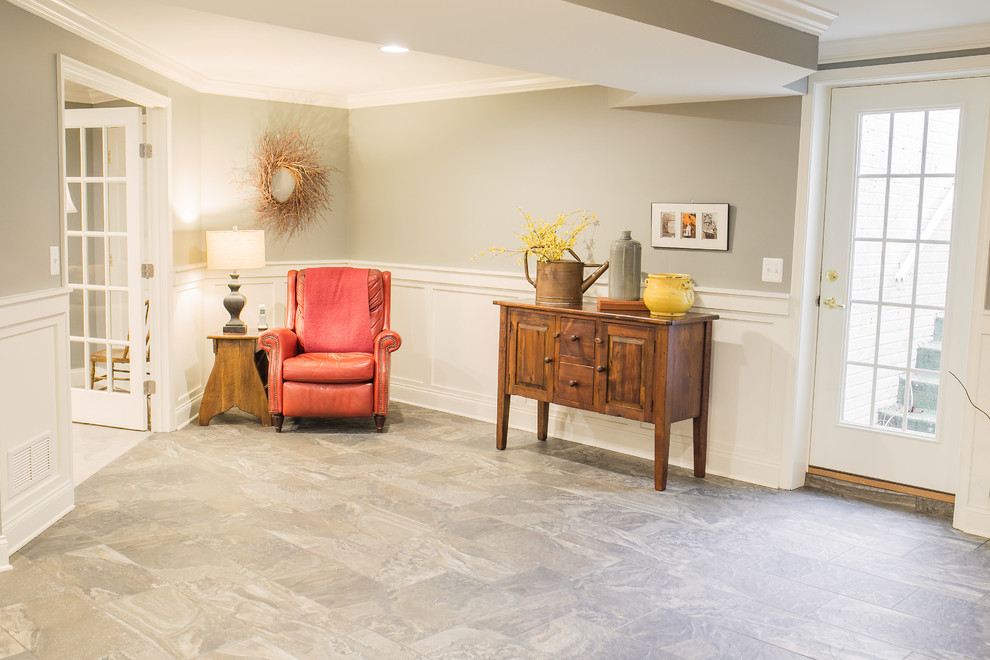 Photo of a medium sized country walk-out basement in Baltimore with grey walls and porcelain flooring.