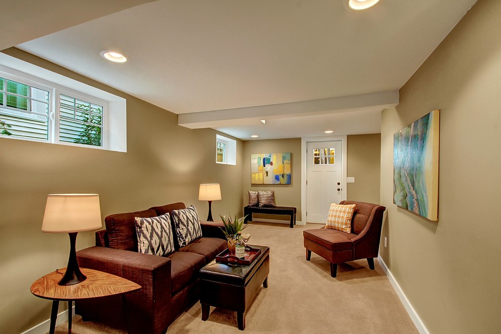 This is an example of a medium sized traditional fully buried basement in Seattle with brown walls, carpet and no fireplace.