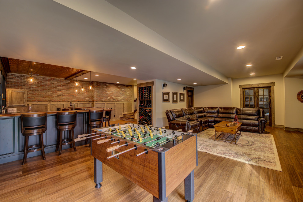 Example of a mid-sized classic underground medium tone wood floor and brown floor basement design in Dallas with beige walls and no fireplace