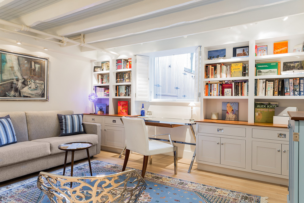 Basement - mid-sized transitional look-out light wood floor basement idea in Boston with white walls